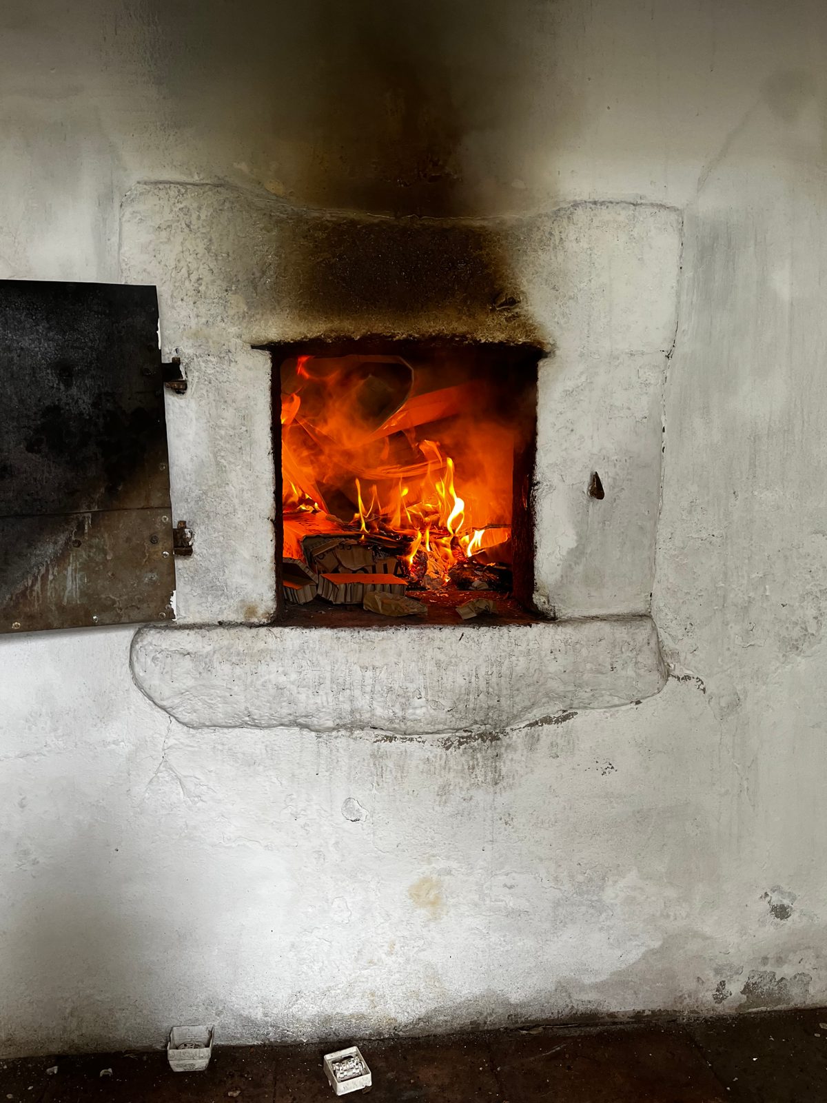Fire burning inside the family’s old brick oven