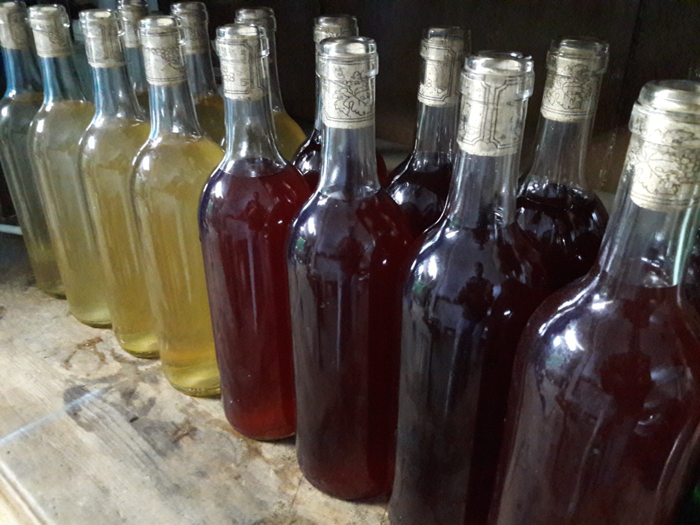 Bottles of wine on a wooden table